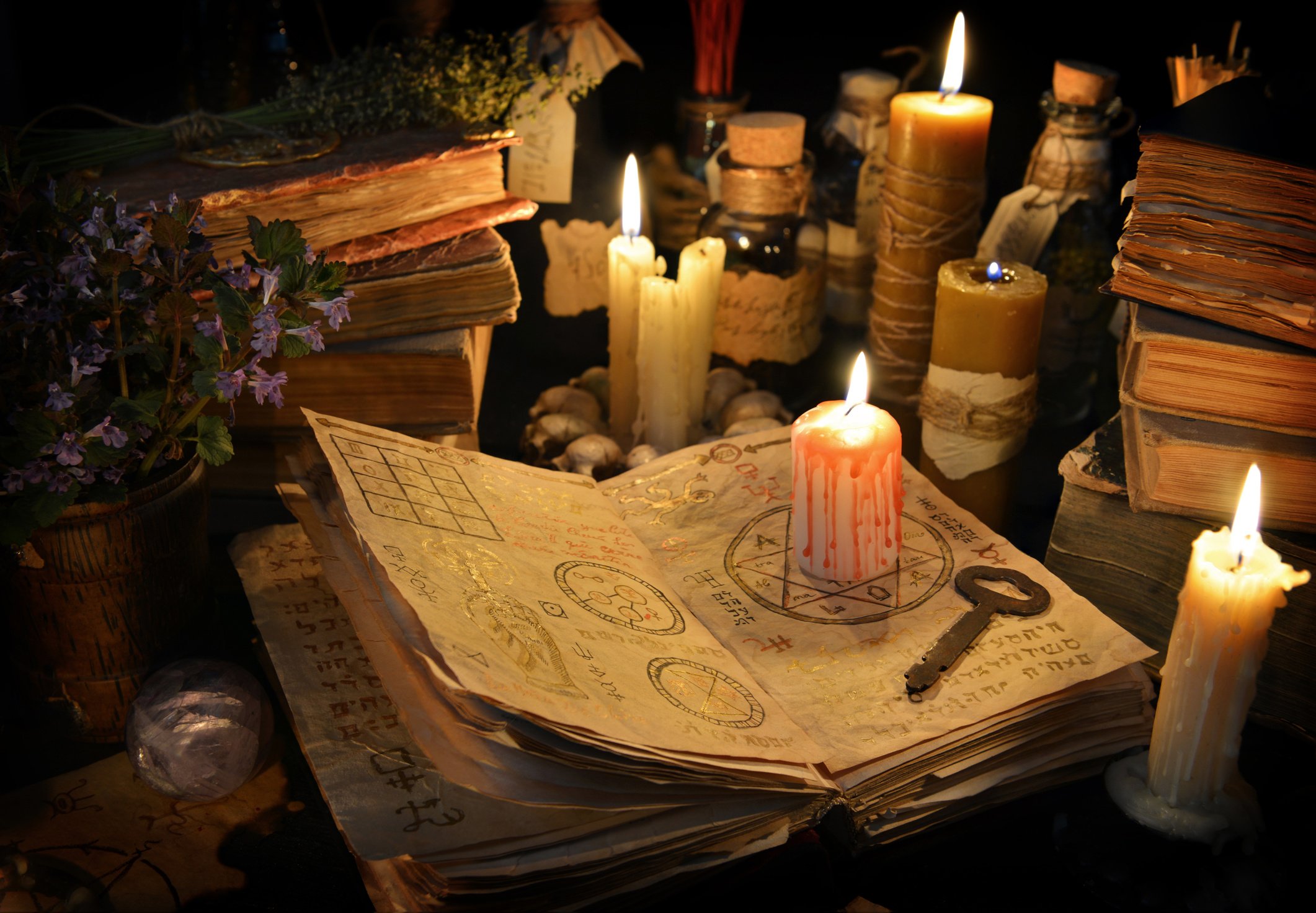 Occult Ritual Setup with Candles and Old Book